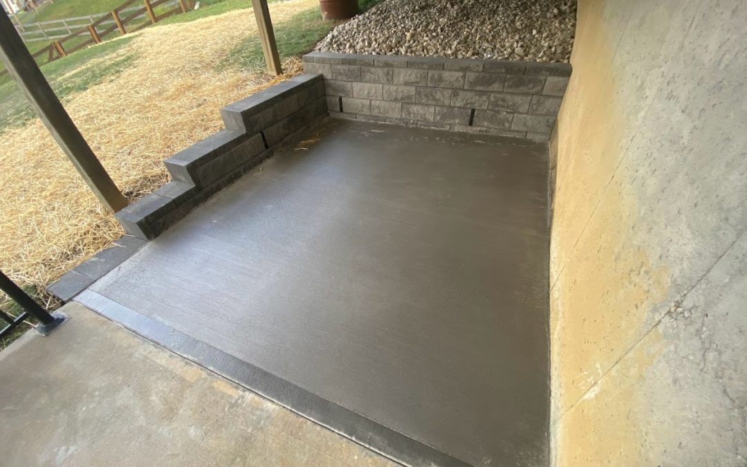 Koroly Concrete Pad, Driveway Extension, New Block Retaining Wall, and Decorative Dry Creek Drainage Installation – Alexandria, Kentucky